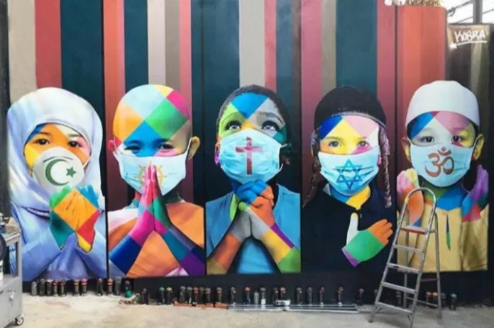 Eduardo Kobra retrata as  5 maiores religiões do planeta unidas contra o coronavírus em mural