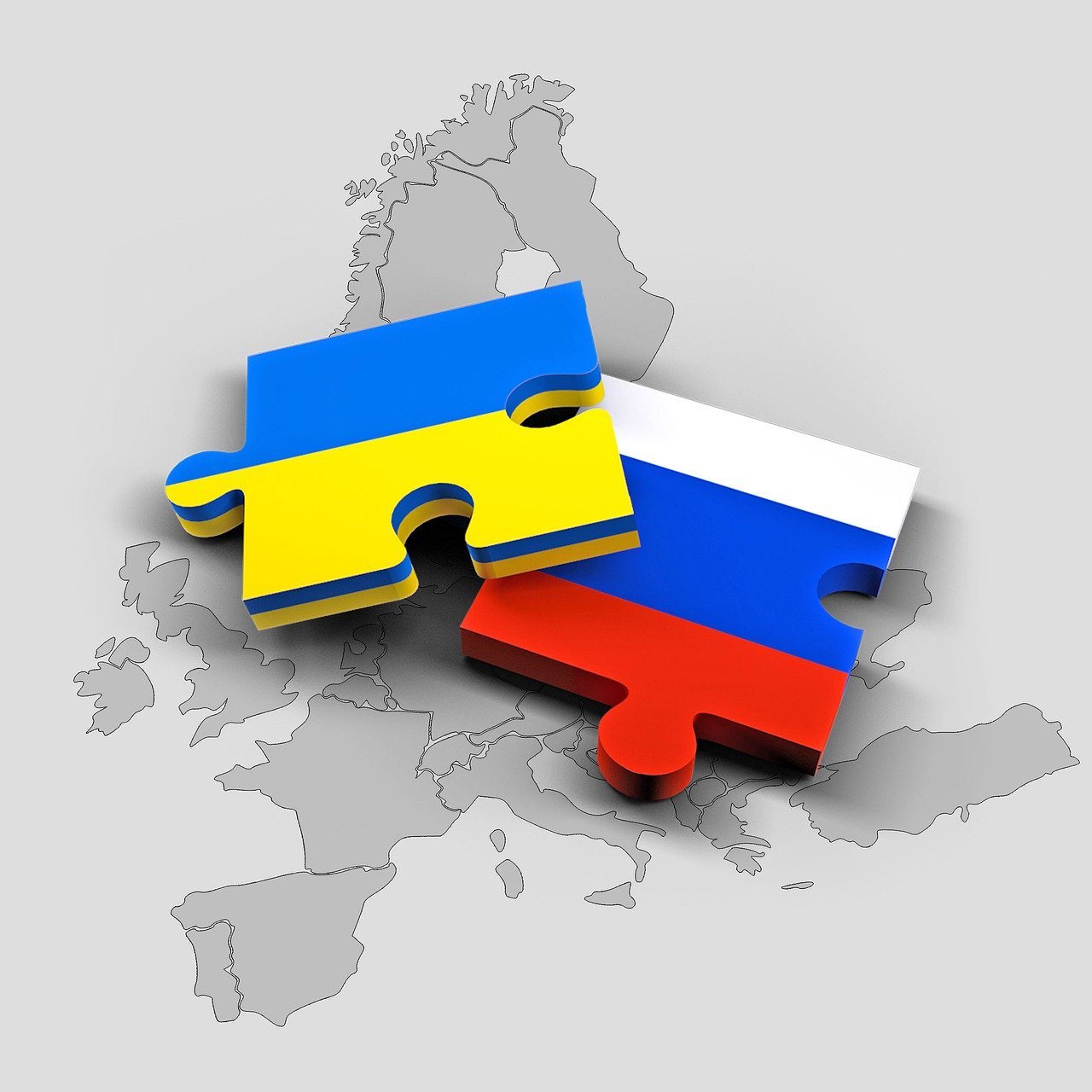 Duas peças de quebra-cabeça, uma com a bandeira da Ucrânia e a outra com o bandeira da Rússia Source: Pixabay