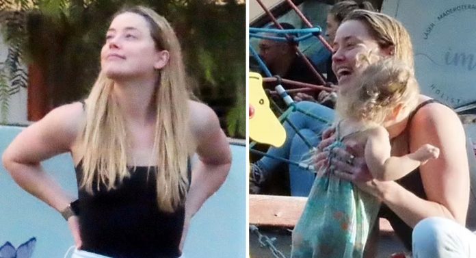 Superou? Uma renovada Amber Heard é flagrada sorridente curtindo a filha em parquinho